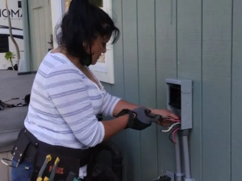 Licensed electrician wiring an exterior subpanel in Croghan